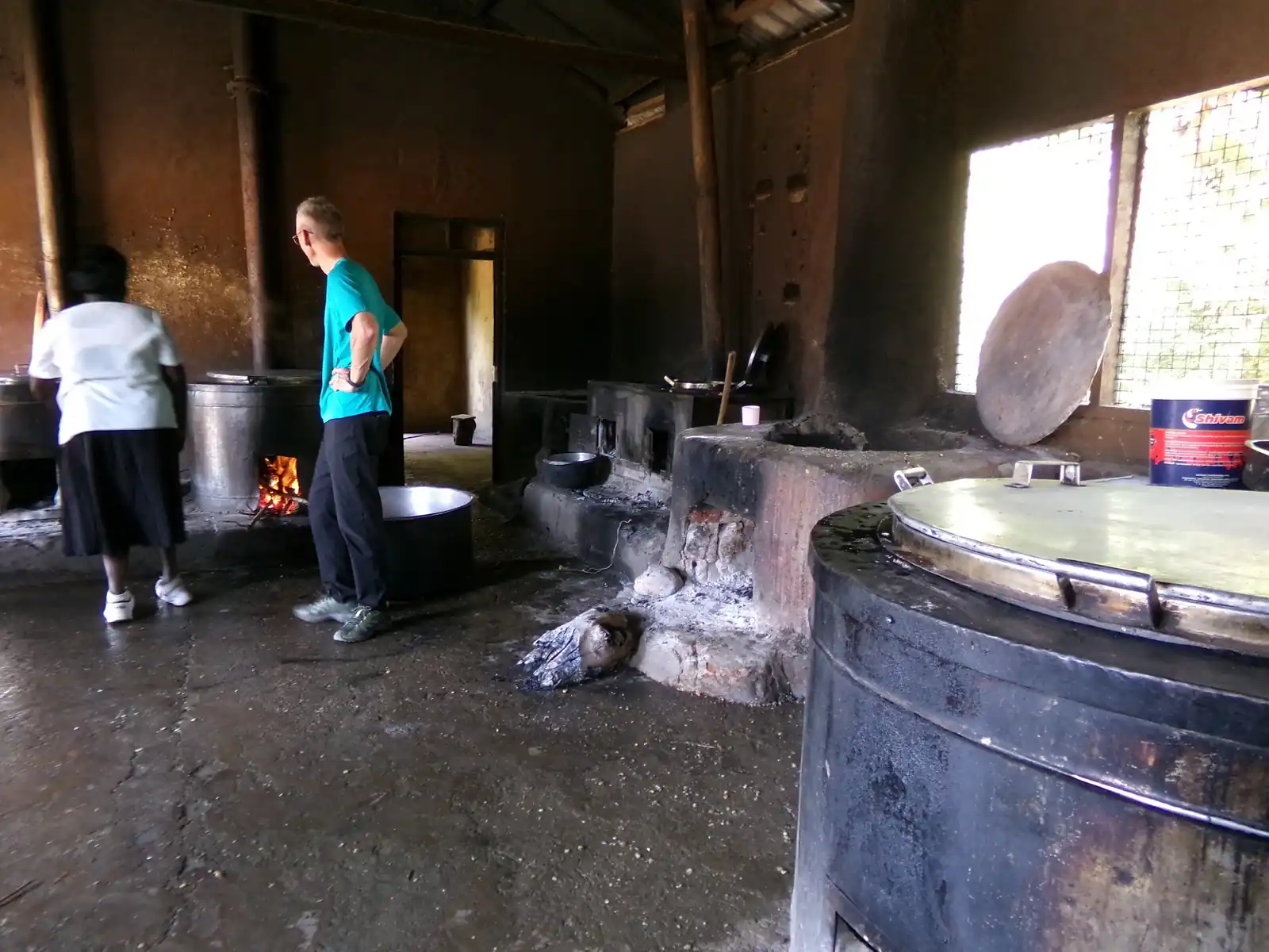 Kitchen staff working at the cooking drums